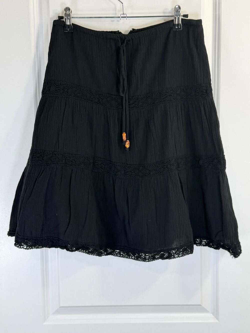Lucy Love Black Tiered Boho Mini Skirt with Crochet Lace Trim and Beaded Tassels - Picture 2 of 7